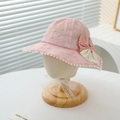 Close-up of pink lace baby sun hat with polka dot bow and pom pom details - 50-52CM / Pink