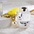 Quicksand tiger keychain with floating white tiger in acrylic oil bottle with yellow strap - White Gas Tank