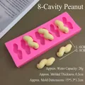 Detailed view of an 8-cavity peanut shaped pink silicone mold for cake decorating - 8-Cavity Peanut Mold