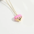 Detailed view of the pink peach heart pendant with a liquid glaze finish and gold chain - Pink