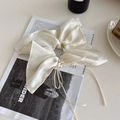 Elegant cream satin hair scrunchie with bow ribbon, pearl, and rhinestone accent - White Shimmer Long Streamer