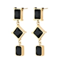 Detailed view of geometric drop earrings with gold metal and black faceted stones - Black
