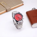 Close-up of chronograph watch with red dial, tachymeter bezel, and steel strap detail - Silver Strap Red Dial