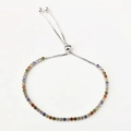 Macro detail of multicolor zircon stones on an adjustable S925 sterling silver bolo bracelet - 2mm Zirconia / Silver with Multicolor Zirconia