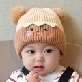 Detail of warm knitted baby hat featuring brown and beige colors with gingerbread embroidery - Khaki - Cartoon Pom Pom