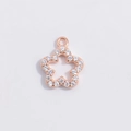 Close-up of rose gold flower pendant featuring five petals and sparkling white zircons - Rose Gold Hollow Petal Star Pendant