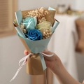 Close-up of handmade soap flower bouquet with blue roses and baby's breath gift - Blue