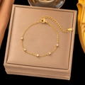 Detail of gold titanium steel bracelet featuring five sparkling white zircon stones - Gold 5-Square Zirconia Bracelet (SLE155)