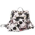 Modern cow print faux leather backpack set with colorful woven strap and gold zippers - Cow Print Beige