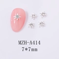 Macro detail of 7x7mm silver star nail charms with crystal rhinestones on pink nails - Silver Starburst White Rhinestone (A414)
