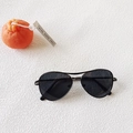 Flat lay of kids aviator sunglasses with black metal frame and dark lenses on white background - Solid Grey