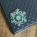 Rotatable snowflake brooch with green gems and zircons on black leather gift box - Silver Green Brooch