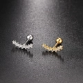 Detail of curved zircon cartilage studs in gold and silver finish with screw ball backs - Curved Row Zirconia