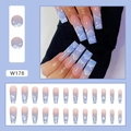 Detail view of pink and blue gradient press-on nails with white cloud and star patterns - Stars And Clouds (W178)