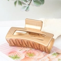 Square champagne gold hollow metal hair claw clip with a glossy finish for women - Metallic Copper