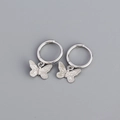 Silver butterfly hoop earrings with polished metal finish and delicate pendant - 925 Silver / White Gold