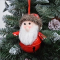 Plush Santa Claus ornament with a large red metal bell on a green Christmas tree - Red and Green Santa Claus