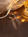 Elegant long gold tassel earrings with cream pearl top on a dark wooden background - Gold Champagne Pearl Long Tassel Dangle