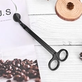 Matte black stainless steel candle wick trimmer on a rustic wooden tabletop - Black Wick Trimmer