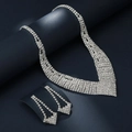 Macro detail of V-shaped rhinestone bridal necklace and drop earrings in silver finish - G0059 2-Piece Set