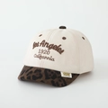 Detailed close-up of beige suede kid baseball cap with leopard print and Los Angeles embroidery - 52cm (2-5 Years) / 1920 - Beige