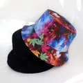 Detail showing reversible bucket hat with black solid side and colorful galaxy maple print - Adult 55-58cm / Galaxy Cannabis Leaf Pattern