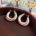 French style C-shaped irregular cream enamel earrings with golden metal borders - French Enamel Twist Cream C-Shape Hoops