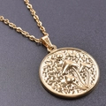 Detailed close-up of golden mushroom pendant with engraved sun and moon patterns - Gold Color + Necklace Chain