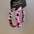 Close-up of leopard print hoop earrings with S925 silver needles on display card - Leather Hoop / Leopard Pink (Silver Earring Post)
