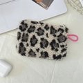 Detail of leopard print plush mini pouch with pink lanyard and secure zipper closure - Cream Leopard