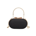 Elegant black oval clutch bag with glitter finish and golden bow clasp for evening wear - Black