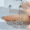 Elegant silver bow earrings with long sparkling rhinestone tassels on a display card - Bowknot Long Tassel Full Diamond Earrings (E37-1)