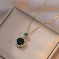 Double round emerald pendant necklace with halo crystals on a golden chain - Emerald