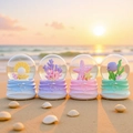 Leuchtende Ozean-Kristallkugeln mit Muscheln und Korallen am Strand bei Sonnenuntergang - Größe 45 Mit Licht / Korallenmeer