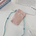 Pink and white checkered fabric phone bag with light blue strap on a minimalist desk - Blush Pink Plaid