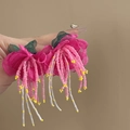 Close-up of pink fabric floral tassel earrings with beaded strands in bohemian style - Pink Seed Bead Tassel (6#)