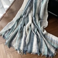 Beige and blue striped cotton linen scarf with fringe edges on a wooden floor - Navy Stripe Gradient