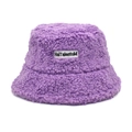Close-up of purple Sherpa bucket hat showing plush texture and embroidered logo label - Purple