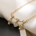 Gold plated necklace with heart and children charms on white silk background - Style 24654 (Three Hearts Family)