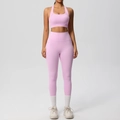 Pink yoga set featuring high-waisted leggings with side pockets and racerback sports bra - Sakura Pink