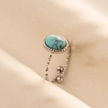 Close-up of vintage silver ring with oval turquoise stone and engraved rhombus texture - Silver Base-Light Blue Stone