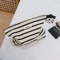 Detail of striped cotton toiletry bag featuring simple wish tag on quilted fabric - Off-white Base Black Stripe