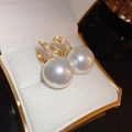 Close-up of large pearl hoop earrings with gold pavé zircons in a white jewelry box - 36# Gold Pearl Hoop