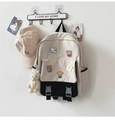 Detail of two-tone canvas backpack with a matching baseball cap and cute bear accessories - Black + 5a Badge + Blush Bear