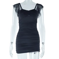 Detail of black slim-fit mini dress with sheer mesh sleeves and ruched fabric texture - S / Black