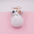 Close-up of a cute calico cat leather keychain with a large white fluffy pom pom - (Gold Chain Clasp) / 14# White