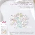 Macro detail of mixed aurora resin bow nail charms with glitter finish and 10.5mm sizing - Large Bow (SP-1120)