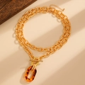Collier double chaîne dorée avec pendentif léopard en acrylique et fermoir à bascule - Style Pendentif Ovale Léopard à Boucle OT Double Couche (A-202)