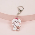 Cute white puppy acrylic keychain with pink bow and sunflower bag on a pink stand - Rabbit with Bag