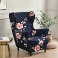 Dark blue stretch wingback chair cover featuring a delicate pink floral pattern - Elegant Blue Floral